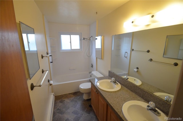 8450 Mason Cir, Westminster, CO 80031 - bathroom featuring toilet, shower / washtub combination, double vanity, and stone finish flooring