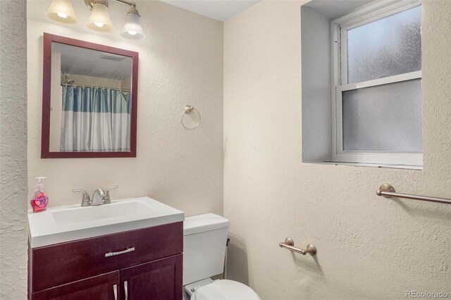 3312 Meadow Ave, Broomfield, CO 80020 - full bath featuring vanity and a textured wall