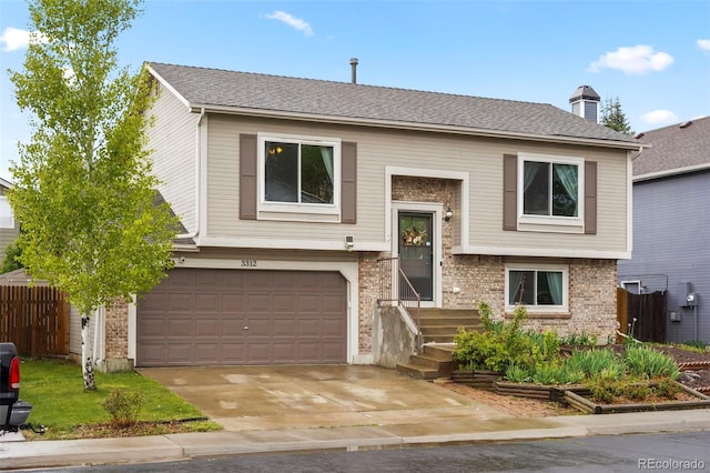 3312 Meadow Ave, Broomfield, CO 80020 - raised ranch with an attached garage, brick siding, concrete driveway, a chimney, and roof with shingles