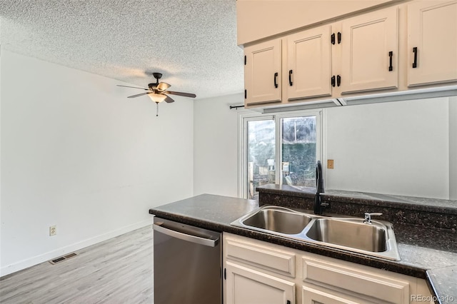 kitchen with light wood-type flooring, a textured ceiling, ceiling fan, sink, and dishwasher