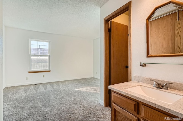 bathroom with vanity and a textured ceiling