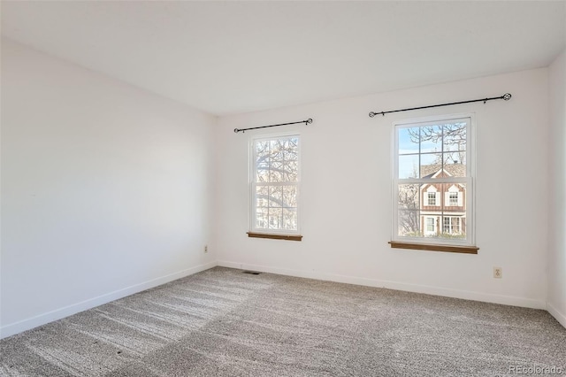 unfurnished room featuring carpet flooring