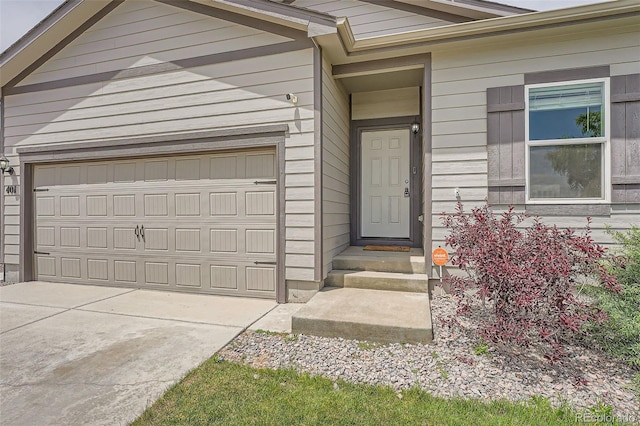 401 Quincy Rr Ave, Keenesburg, CO 80643 - property entrance with driveway and a garage