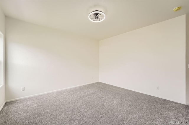 401 Quincy Rr Ave, Keenesburg, CO 80643 - carpeted spare room featuring a smoke detector and baseboards