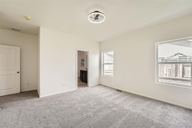 401 Quincy Rr Ave, Keenesburg, CO 80643 - unfurnished bedroom featuring carpet flooring, baseboards, and connected bathroom
