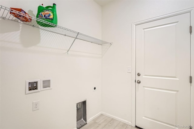 401 Quincy Rr Ave, Keenesburg, CO 80643 - washroom with hookup for an electric dryer, hookup for a washing machine, light wood-style floors, and baseboards