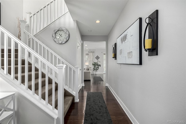 interior space featuring stairs, dark wood-style flooring, recessed lighting, and baseboards