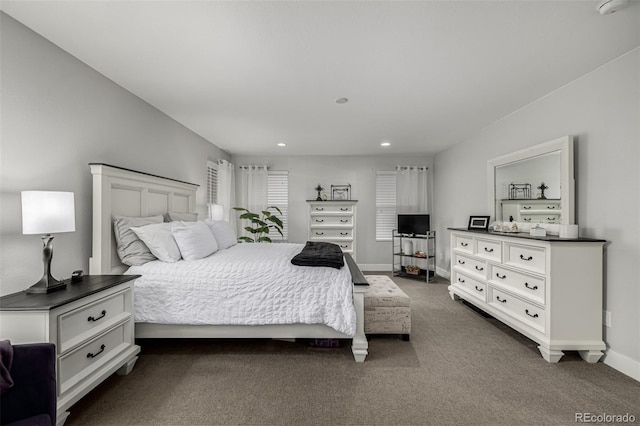 bedroom featuring recessed lighting, dark carpet, and baseboards