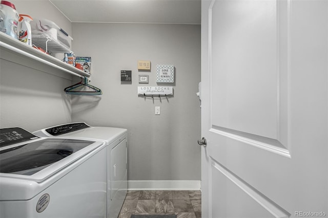 clothes washing area featuring laundry area, washer and clothes dryer, and baseboards