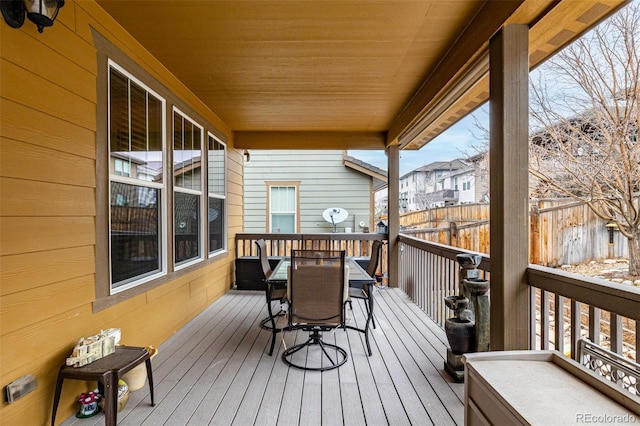 wooden deck featuring outdoor dining area