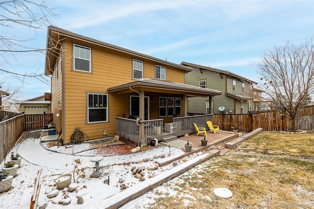 view of front of home featuring a fenced backyard and a deck