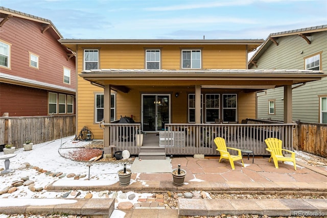 exterior space with a patio, a wooden deck, and fence