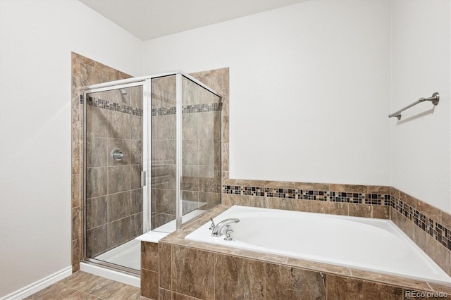 bathroom with separate shower and tub