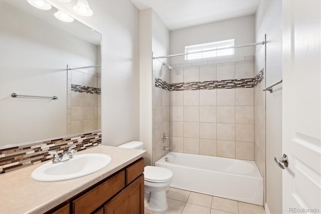 full bathroom with tasteful backsplash, toilet, shower / tub combination, tile patterned floors, and vanity