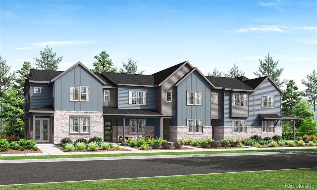 2897 E 103rd Dr, Thornton, CO 80229 - view of front facade with board and batten siding, french doors, and stone siding