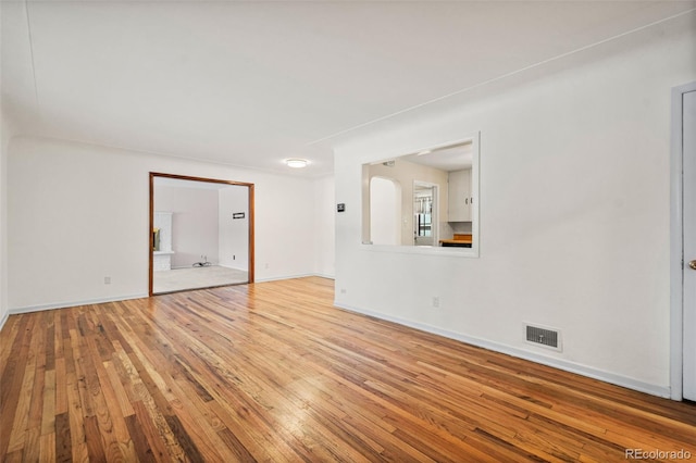 spare room featuring light hardwood / wood-style floors