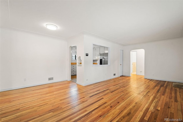 unfurnished living room with hardwood / wood-style floors