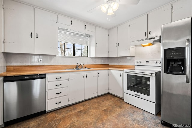 kitchen with ceiling fan, sink, white cabinetry, decorative backsplash, and stainless steel appliances