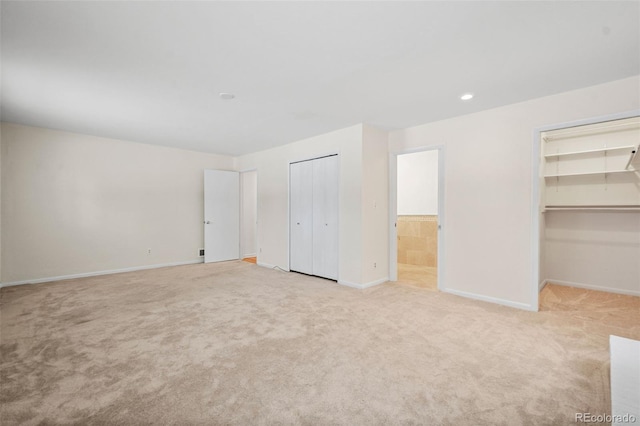 unfurnished bedroom with light carpet