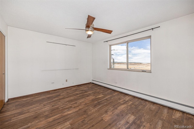 unfurnished room with dark wood-type flooring, a baseboard radiator, ceiling fan, and a textured ceiling