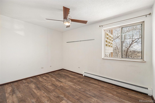 unfurnished room featuring ceiling fan, a baseboard heating unit, a textured ceiling, and dark hardwood / wood-style flooring