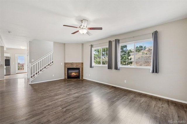 2541 Hot Springs Ct, Colorado Springs, CO 80919 - unfurnished living room with ceiling fan, baseboards, and wood finished floors