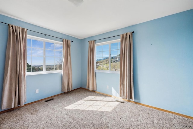2541 Hot Springs Ct, Colorado Springs, CO 80919 - carpeted empty room with baseboards and visible vents