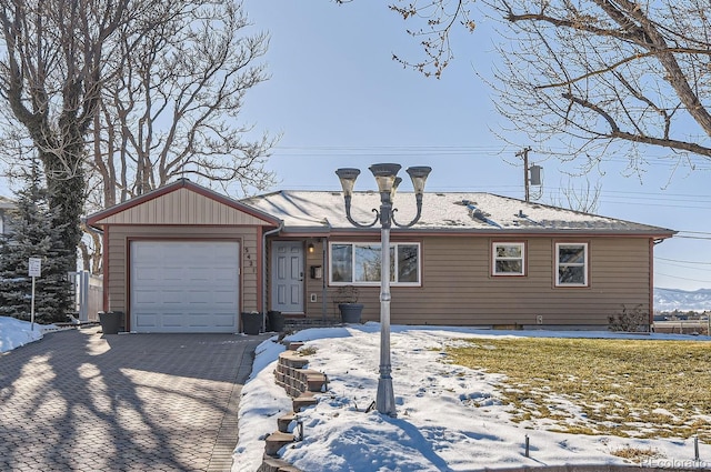 ranch-style home featuring a garage