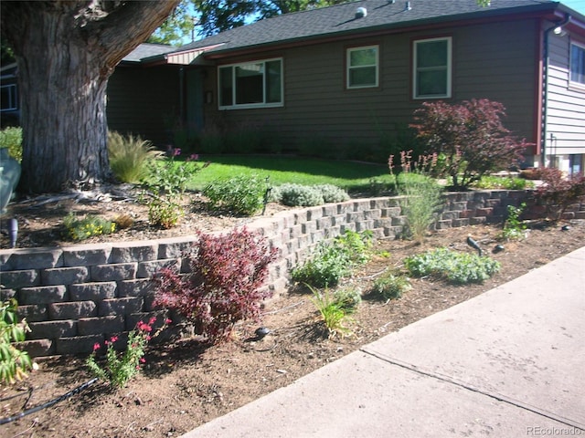 view of property exterior featuring a yard