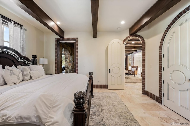 bedroom featuring beamed ceiling