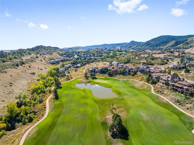 drone / aerial view featuring a water and mountain view