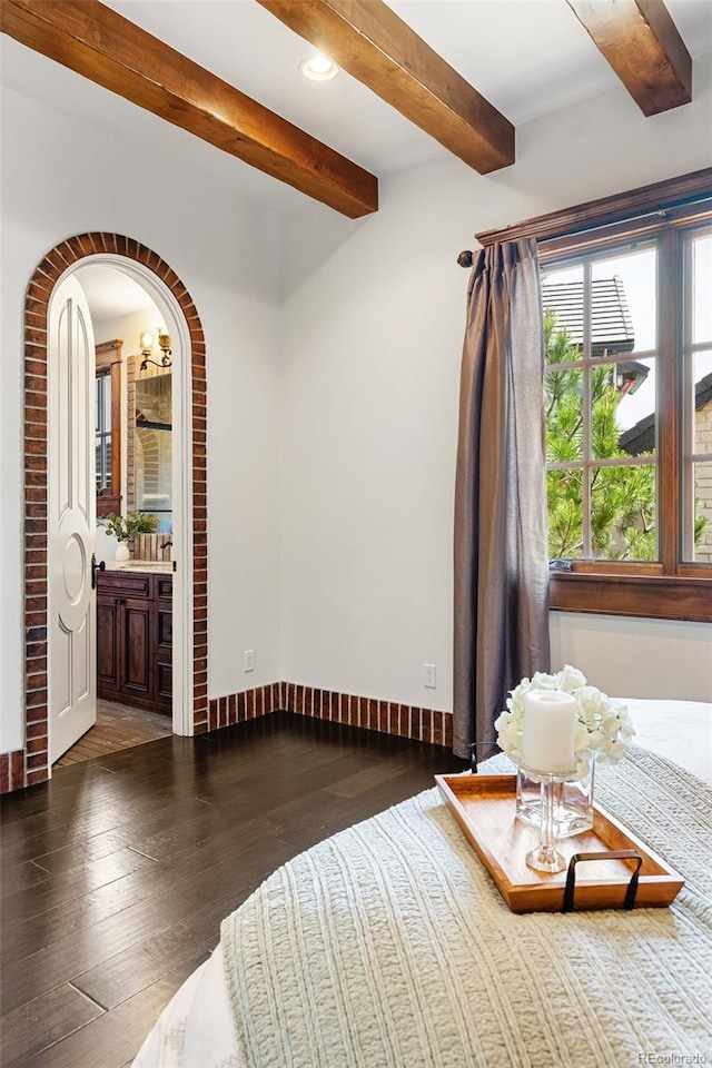 7188 Raphael Ln, Littleton, CO 80125 - bedroom featuring beamed ceiling, wood-type flooring, arched walkways, recessed lighting, and baseboards