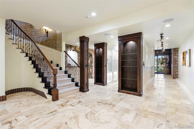 7188 Raphael Ln, Littleton, CO 80125 - entryway featuring stairway, recessed lighting, baseboards, and ornate columns