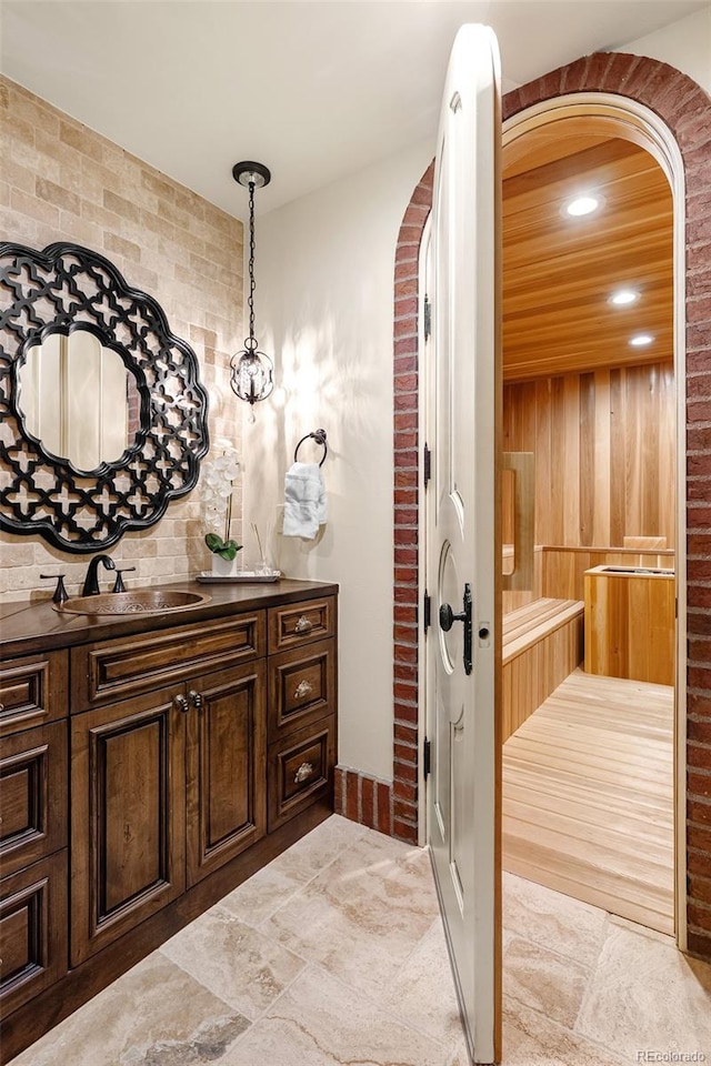 7188 Raphael Ln, Littleton, CO 80125 - bathroom featuring vanity, a relaxing sauna, and recessed lighting