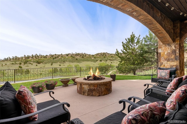 7188 Raphael Ln, Littleton, CO 80125 - view of patio / terrace featuring an outdoor fire pit