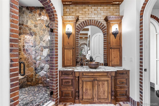 7188 Raphael Ln, Littleton, CO 80125 - bathroom featuring a shower stall, vanity, and baseboards