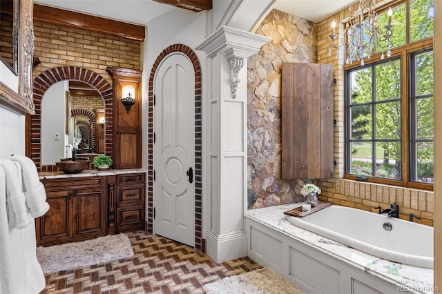 7188 Raphael Ln, Littleton, CO 80125 - bathroom with a garden tub and vanity