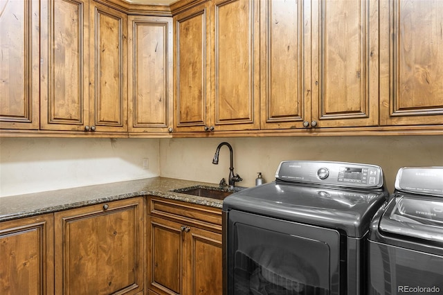 7188 Raphael Ln, Littleton, CO 80125 - laundry room featuring independent washer and dryer and cabinet space