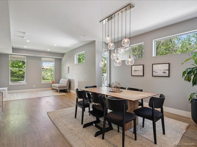 2508 S Pennsylvania St, Denver, CO 80210 - dining space featuring baseboards, light wood finished floors, and recessed lighting