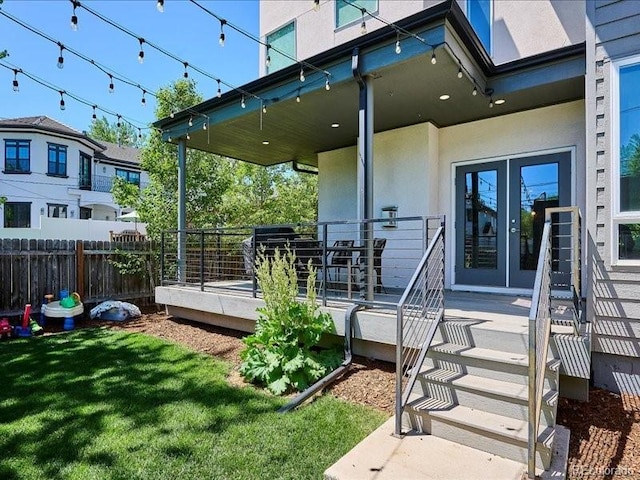 2508 S Pennsylvania St, Denver, CO 80210 - view of exterior entry featuring french doors, stucco siding, and a wooden deck