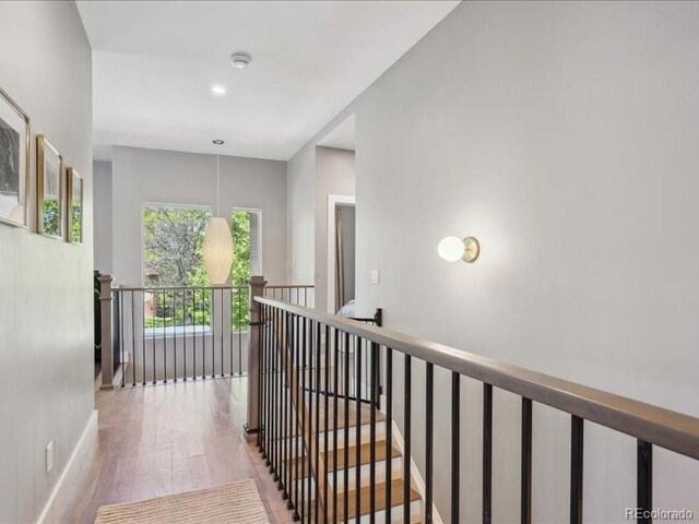 2508 S Pennsylvania St, Denver, CO 80210 - corridor with an upstairs landing, wood finished floors, and recessed lighting