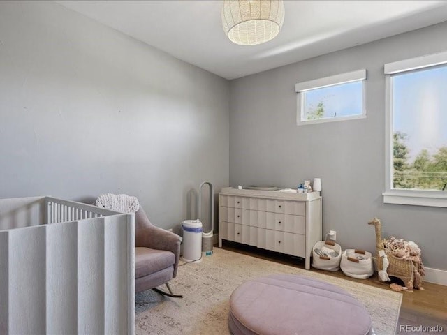 2508 S Pennsylvania St, Denver, CO 80210 - bedroom with a nursery area, wood finished floors, and baseboards