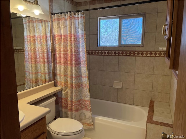 bathroom featuring shower / tub combo, toilet, and vanity