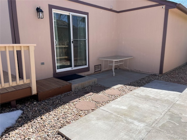 doorway to property featuring a patio