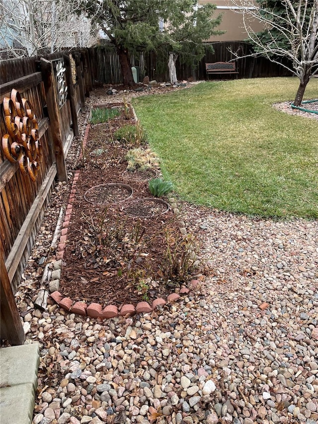 view of yard with a fenced backyard