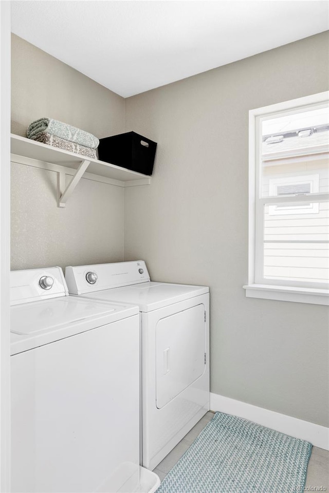 8917 Yates Dr, Westminster, CO 80031 - washroom with independent washer and dryer, baseboards, and light tile patterned flooring