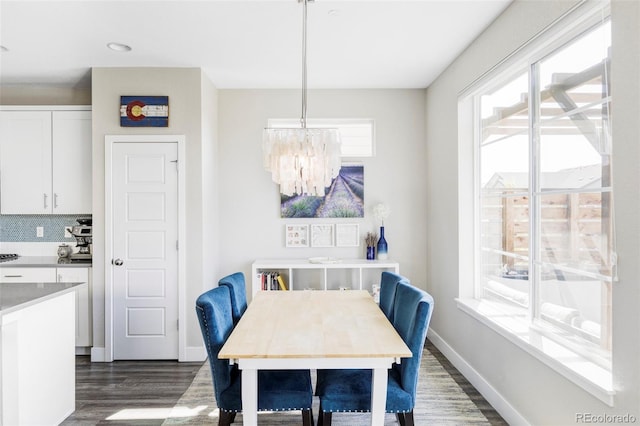 8917 Yates Dr, Westminster, CO 80031 - dining room featuring dark wood-type flooring, a chandelier, baseboards, and recessed lighting
