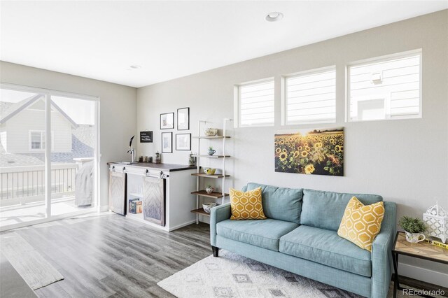 8917 Yates Dr, Westminster, CO 80031 - living room with wood finished floors, plenty of natural light, recessed lighting, and baseboards