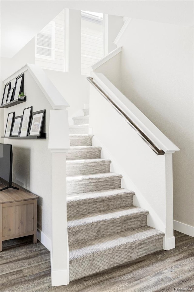 8917 Yates Dr, Westminster, CO 80031 - stairs featuring wood finished floors and baseboards