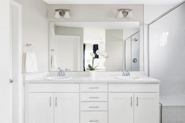 8917 Yates Dr, Westminster, CO 80031 - full bathroom featuring a stall shower and double vanity